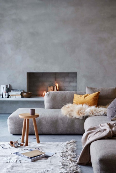 Microcement covered fireplace and floor