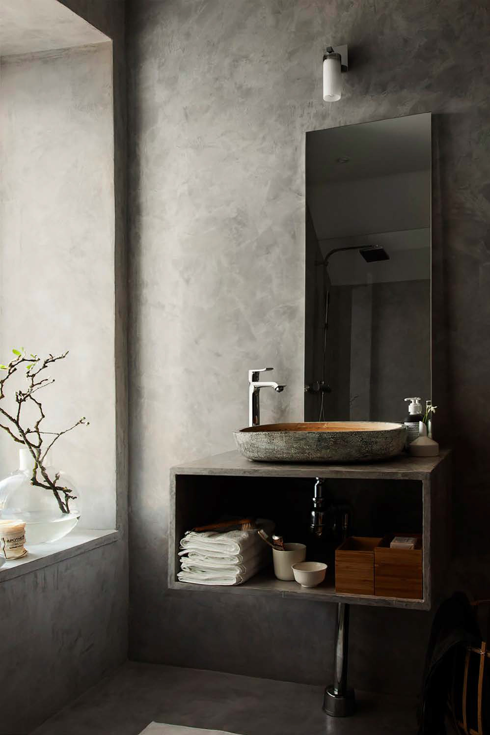 Dark microcement bathroom
